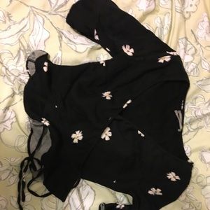 Black wrap crop top with flowers on it